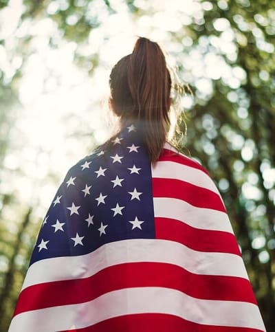Girl with American Flag on her shoulders_Usher Law Firm